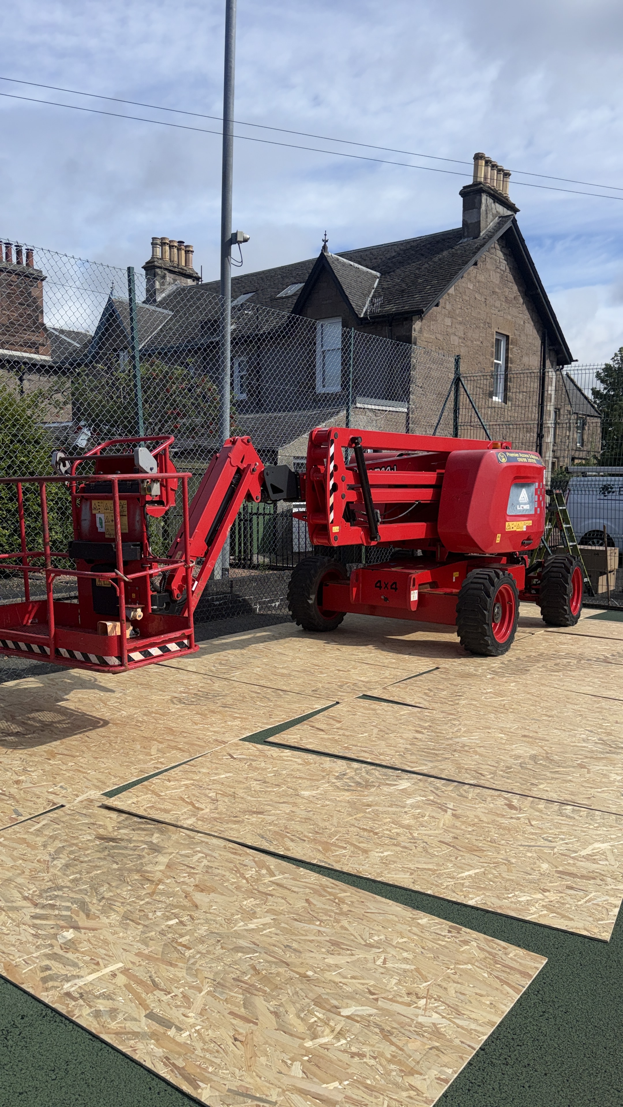 Cherry picker on protected access route at Perth Tennis Club